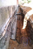 Произвели усиление старого фундамента путем нагнетания под старый фундамент бетона и дополнительного армирования